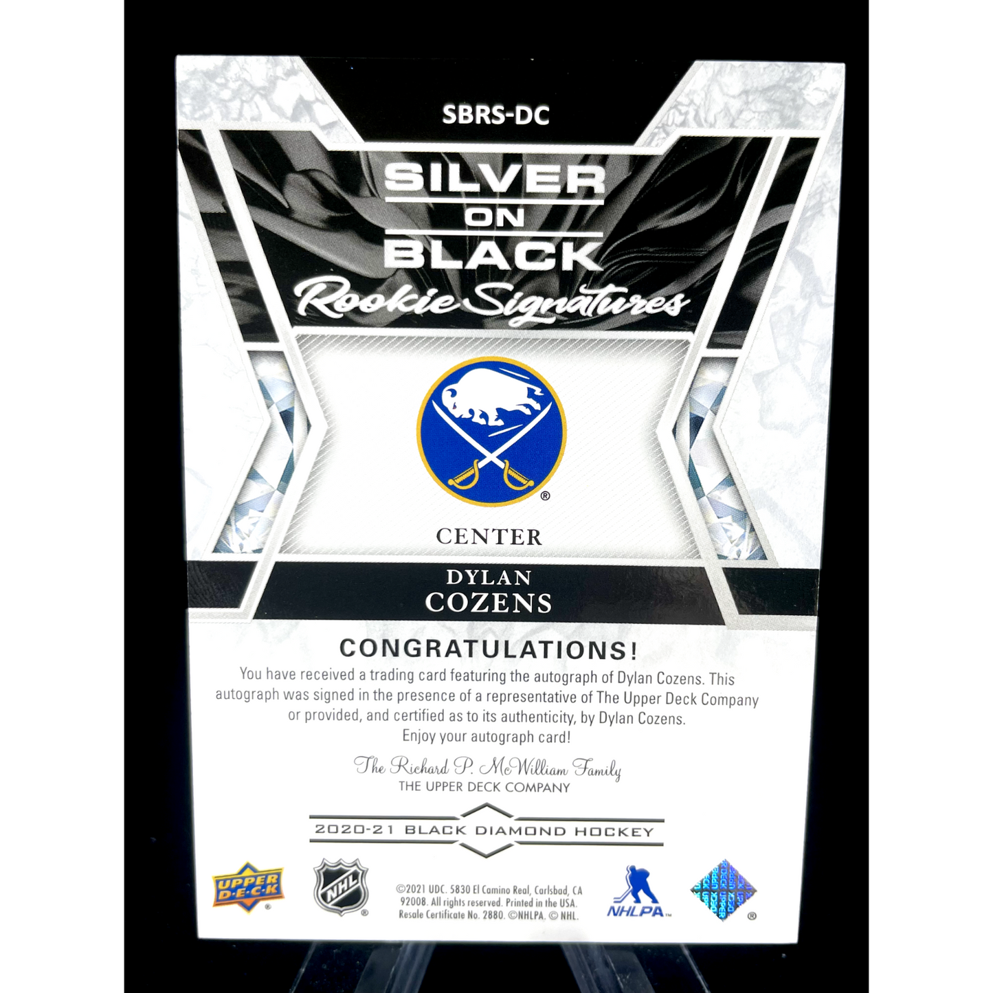 Dylan Cozens 2020-21 Upper Deck Black Diamond Silver on Black Rookie Auto 42/99